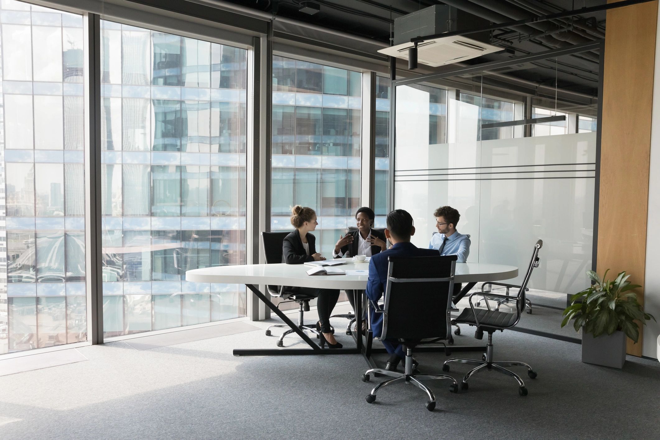 Business team discussing employee benefits in a modern office