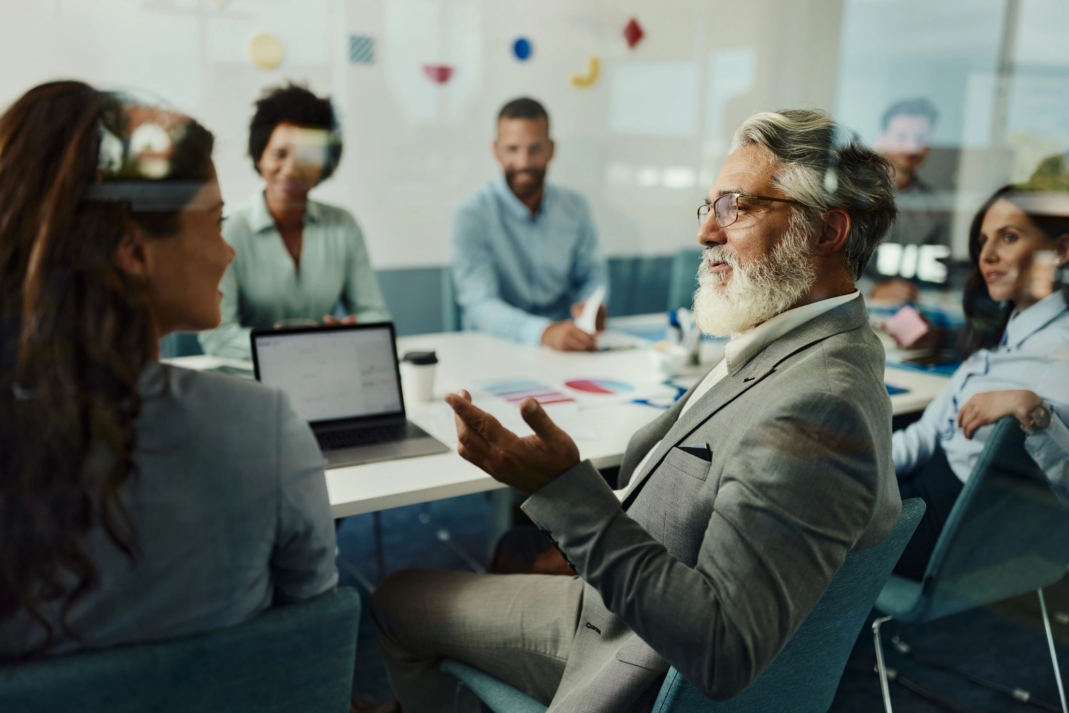 Colleagues meeting in an office to review coverage options